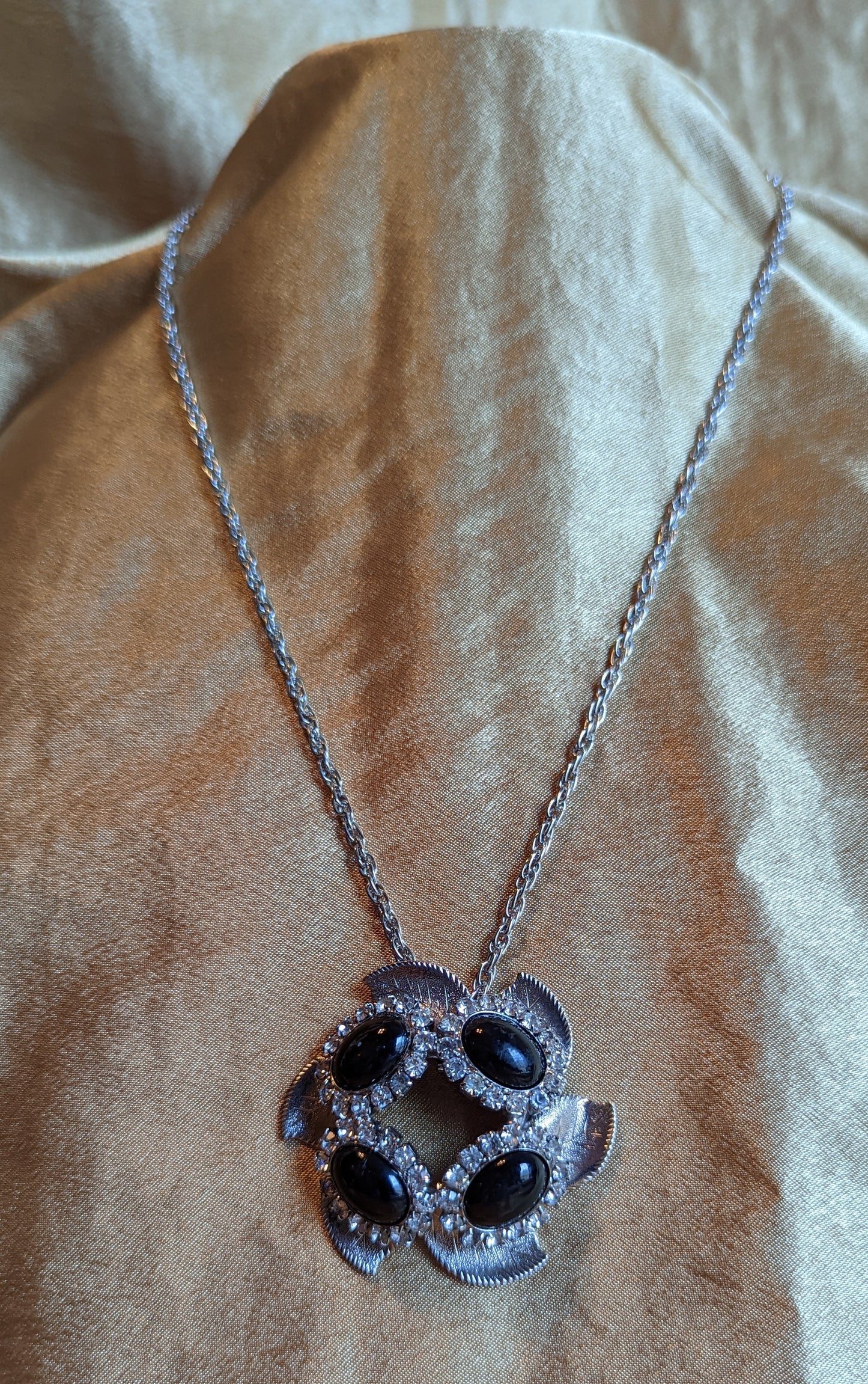 Silver Tone Floral Pendant Necklace with Black Glass Cabochon